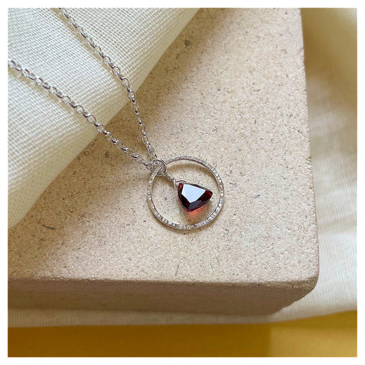 Mini Sterling Silver Hammered Circle and Garnet Trilliant Broilette Necklace.