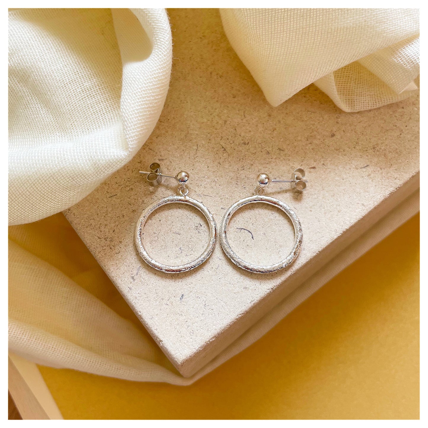 Sterling Silver Textured Circle Drop Stud earrings.