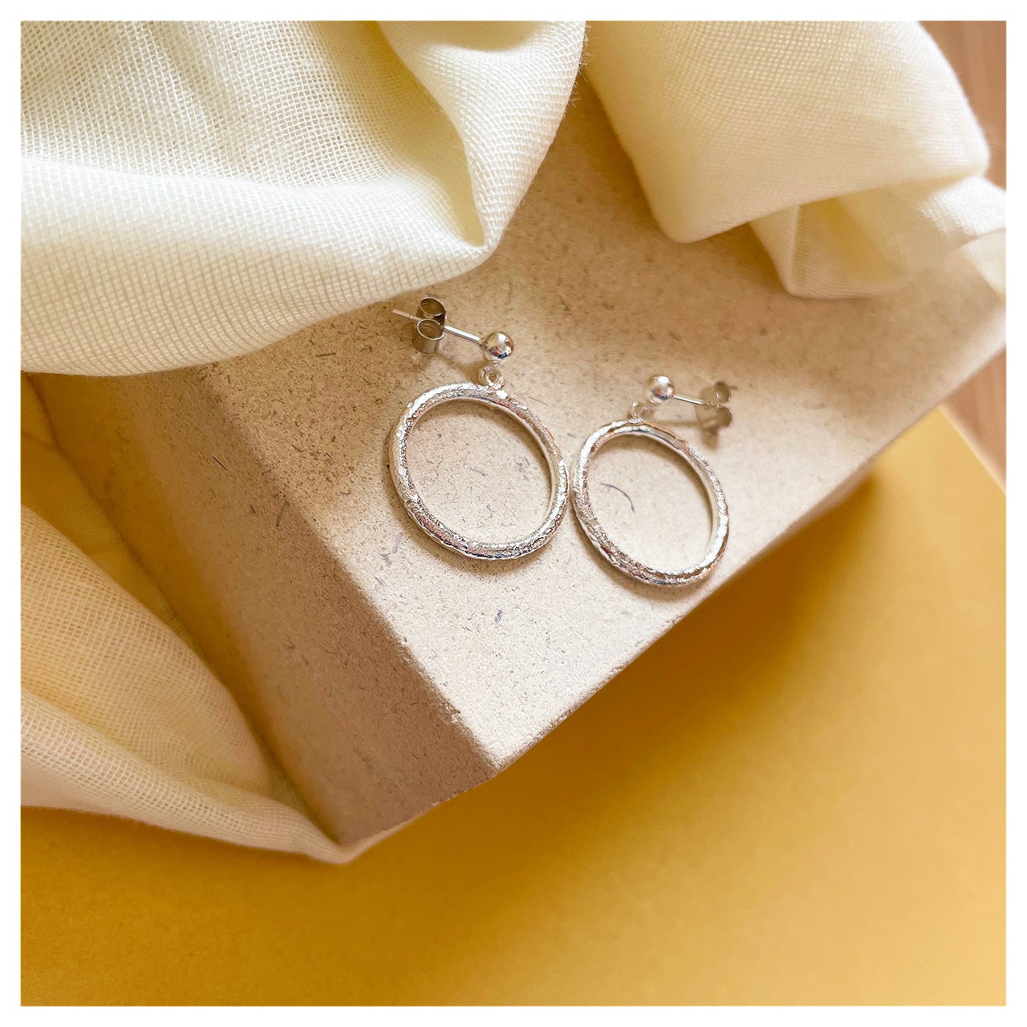 Sterling Silver Textured Circle Drop Stud earrings.