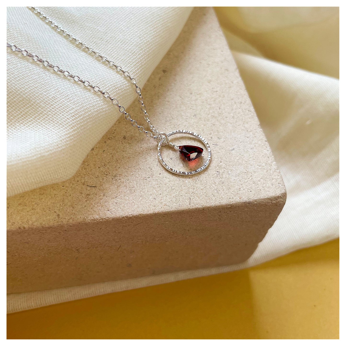 Mini Sterling Silver Hammered Circle and Garnet Trilliant Broilette Necklace.