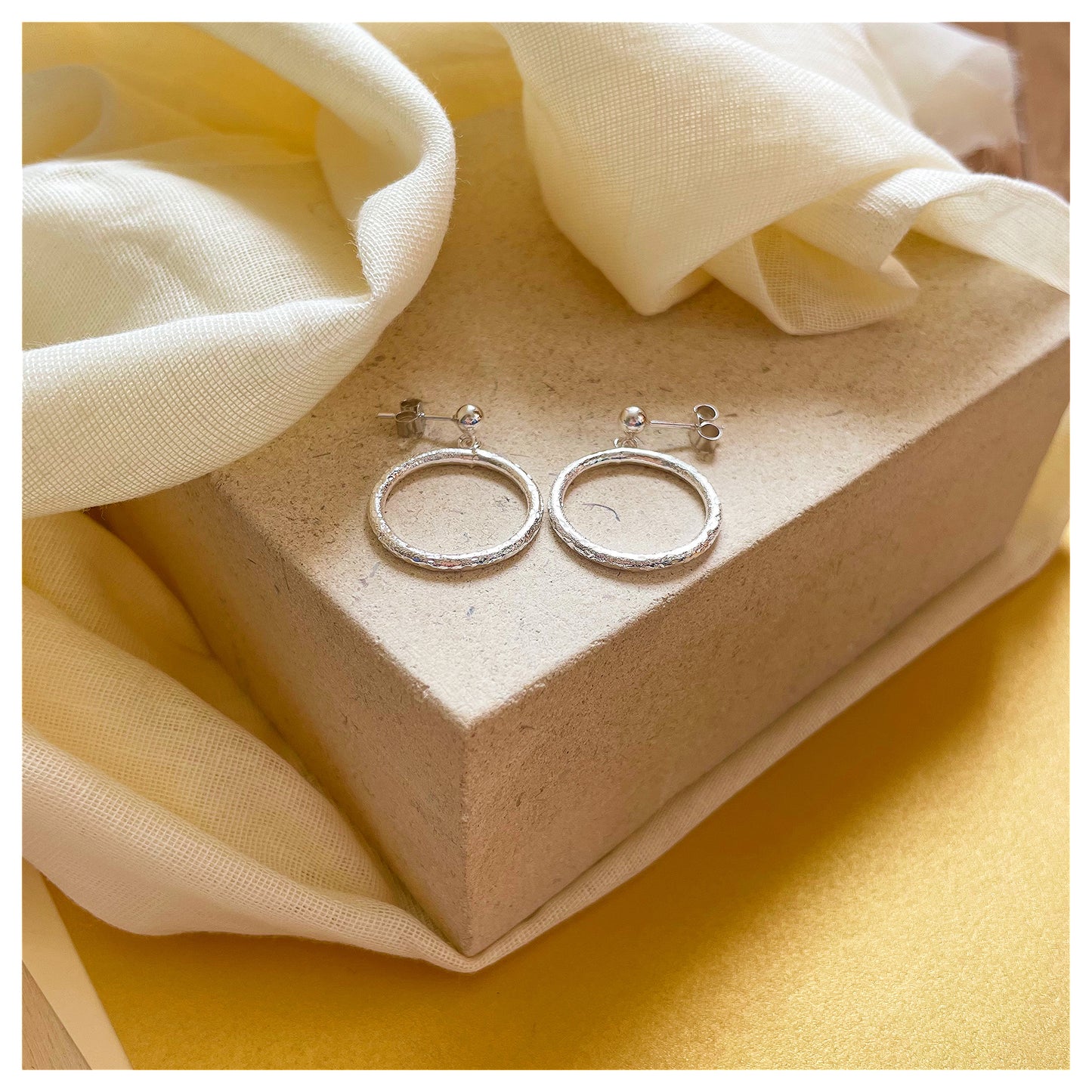 Sterling Silver Textured Circle Drop Stud earrings.